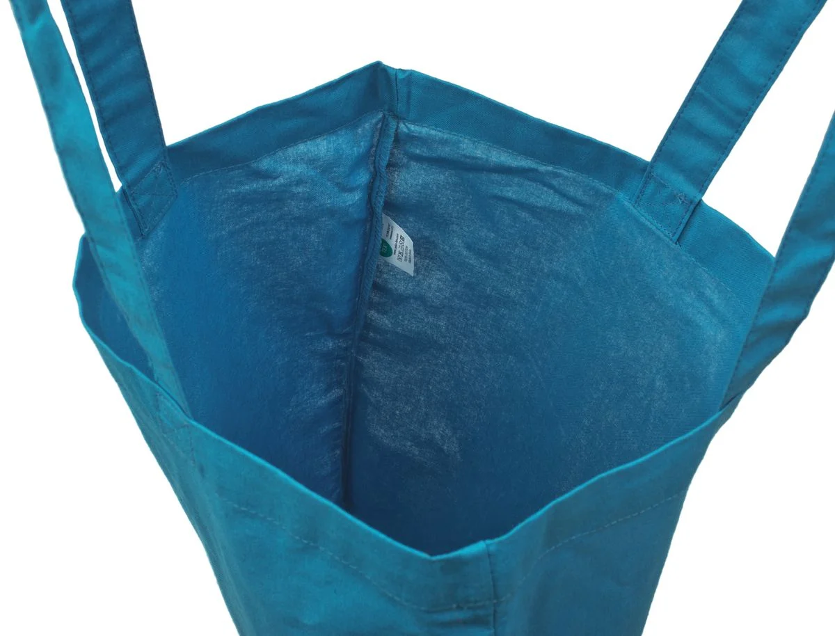Bomullsnett, 140 g/m², innside med etikett – lyseblått